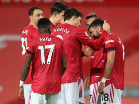 Manchester United players celebrating a goal Bruno Fernandes scored.